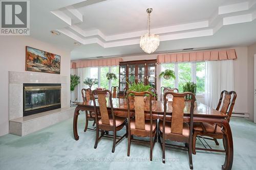 401 - 10 Armstrong Drive, Smiths Falls, ON - Indoor Photo Showing Dining Room With Fireplace