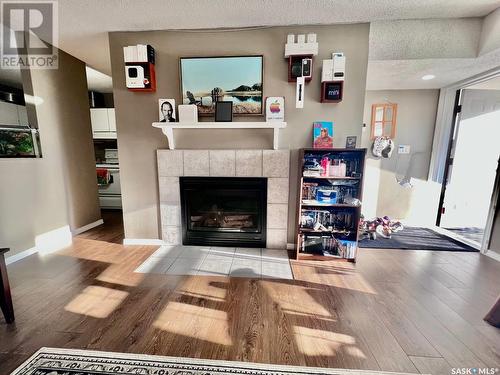 82 Gore Place, Regina, SK - Indoor Photo Showing Living Room With Fireplace