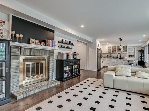 Family room - 1200 Rue Rembrandt, Brossard, QC - Indoor Photo Showing Living Room With Fireplace