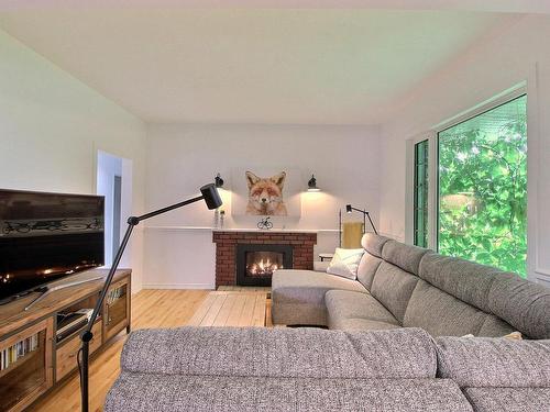 Salon - 120 10E Avenue, Senneterre - Ville, QC - Indoor Photo Showing Living Room With Fireplace