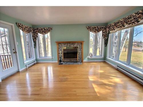Autre - 304 Route 132 E., New Richmond, QC - Indoor Photo Showing Living Room With Fireplace