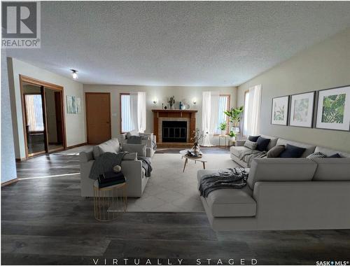 349 Cypress Drive, Swift Current, SK - Indoor Photo Showing Living Room With Fireplace