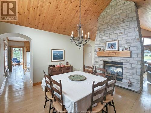 34 Albania, Haut-Lamèque, NB - Indoor Photo Showing Dining Room With Fireplace