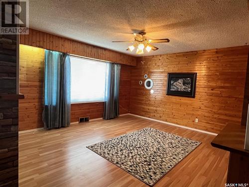 169 Road Allowance, Calder, SK - Indoor Photo Showing Other Room With Fireplace