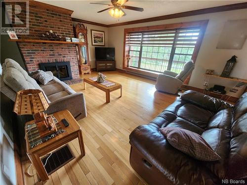 72 Mazerolle Street, Saint-Léonard-Parent, NB - Indoor Photo Showing Living Room With Fireplace