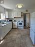 211 3Rd Street W, Meadow Lake, SK  - Indoor Photo Showing Kitchen With Double Sink 