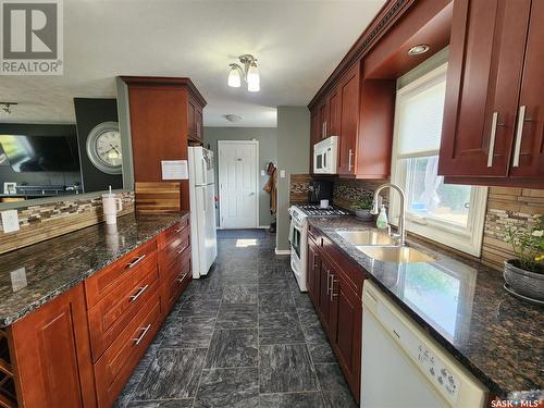 202 Mehnke Street, Ogema, SK - Indoor Photo Showing Kitchen With Double Sink