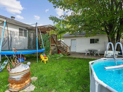 Backyard - 1190  - 1190A Rue Des Bouleaux, Saint-Jérôme, QC - Outdoor With Above Ground Pool With Exterior