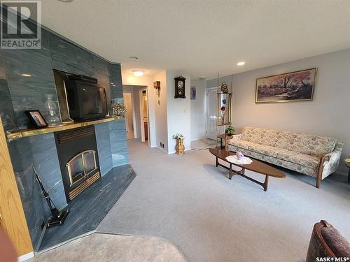 5 Christel Crescent, Lac Des Iles, SK - Indoor Photo Showing Living Room With Fireplace