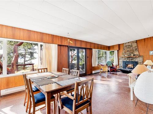 498 Marine Trnabt, Mayne Island, BC - Indoor Photo Showing Dining Room With Fireplace