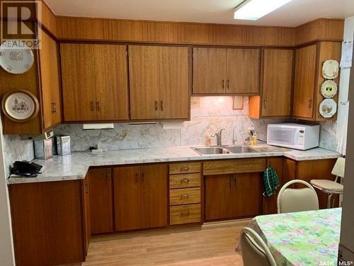 616 Beharrel Avenue, Oxbow, SK - Indoor Photo Showing Kitchen With Double Sink