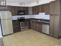 106 2322 Killdeer Drive, North Battleford, SK  - Indoor Photo Showing Kitchen With Double Sink 