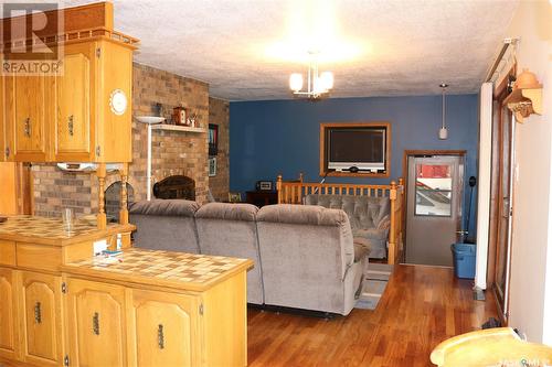 302 Barrows Street, Maryfield, SK - Indoor Photo Showing Living Room With Fireplace