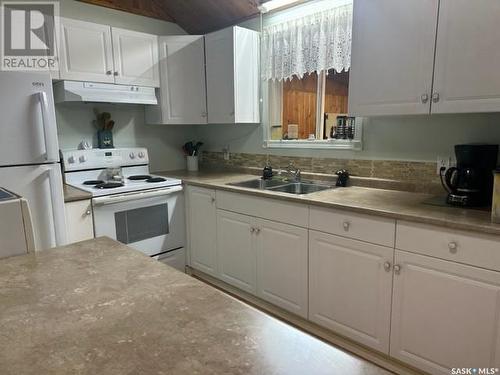 7 11 Waskos Drive, Lac La Ronge, SK - Indoor Photo Showing Kitchen With Double Sink