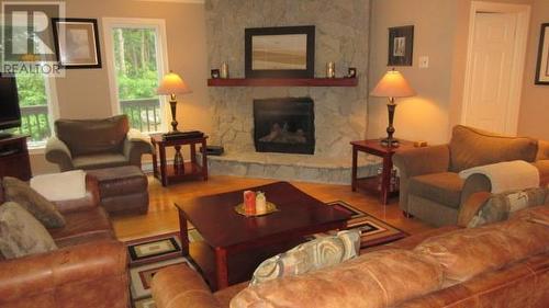 4 River Grove, Humber Valley Resort, NL - Indoor Photo Showing Living Room With Fireplace