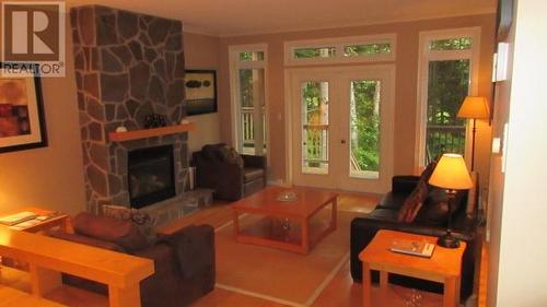 4 River Grove, Humber Valley Resort, NL - Indoor Photo Showing Living Room With Fireplace