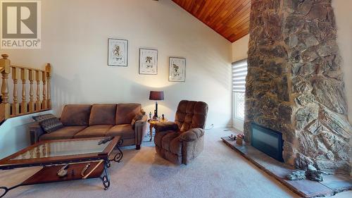 10818 102 Street, Fort St. John, BC - Indoor Photo Showing Living Room With Fireplace