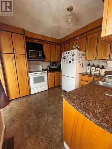 6 Brakes Sub-Division, Marystown, NL - Indoor Photo Showing Living Room With Fireplace