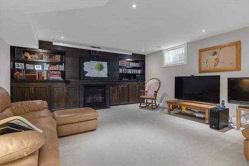 Custom built in cabinets and shelving - 123 William Street, Niagara-On-The-Lake, ON - Indoor With Fireplace
