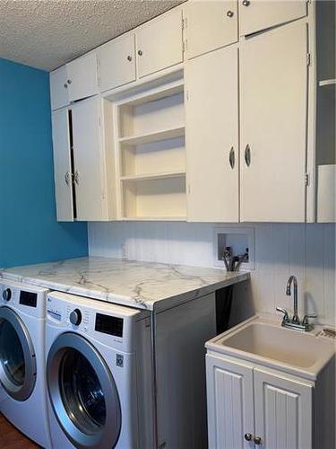 456 9Th Avenue N, Swan River, MB - Indoor Photo Showing Laundry Room