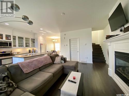 B 422 St Mary Street, Esterhazy, SK - Indoor Photo Showing Living Room With Fireplace