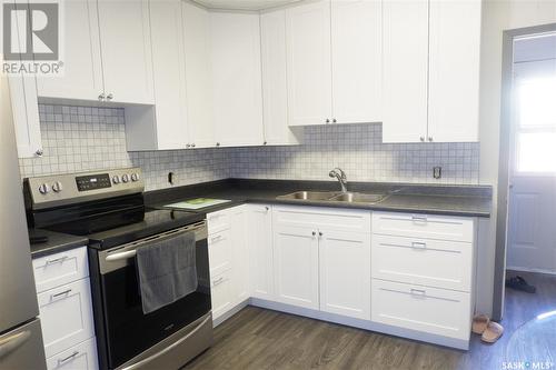418 5Th Avenue W, Assiniboia, SK - Indoor Photo Showing Kitchen With Double Sink