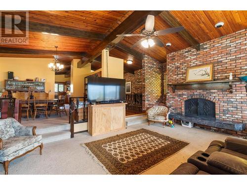 2545 6 Highway E, Lumby, BC - Indoor Photo Showing Living Room With Fireplace