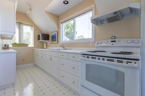 A well-equipped secondary kitchen is great for extended family stays or even for that university student returning home temporarily - 23 Winona Park Road, Stoney Creek, ON - Indoor Photo Showing Kitchen With Double Sink