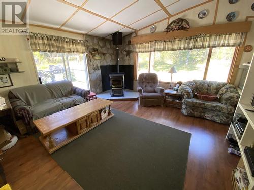 7969 Scherger Road, 70 Mile House, BC - Indoor Photo Showing Living Room With Fireplace
