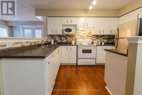 #113 -1450 Bishops Gate, Oakville, ON - Indoor Photo Showing Kitchen With Double Sink