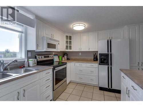 15 54115 Guest Road, Vanderhoof, BC - Indoor Photo Showing Kitchen With Double Sink