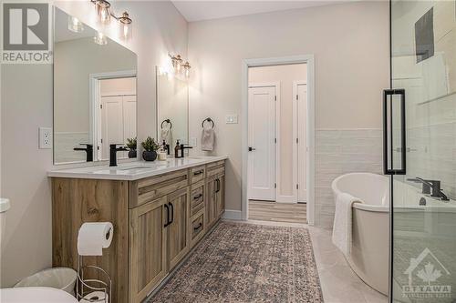 2nd full bath *NOT THE HOME FOR SALE - SAME MODEL PREVIOUSLY BUILT BY BUILDER* Stand alone bath and separate shower is an upgrade. Standard is Shower Tub with linen - 260 Trudeau Crescent, Russell, ON - Indoor Photo Showing Bathroom