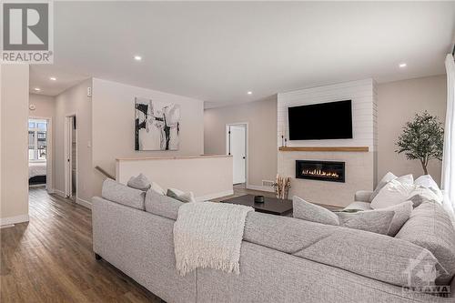 *NOT THE HOME FOR SALE - SAME MODEL PREVIOUSLY BUILT BY BUILDER* - 260 Trudeau Crescent, Russell, ON - Indoor Photo Showing Living Room With Fireplace