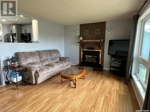 167 Montgomery Crescent, Weyburn, SK - Indoor Photo Showing Living Room With Fireplace