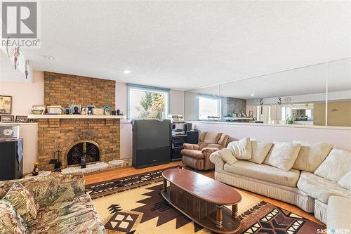 75 Williston Drive, Regina, SK - Indoor Photo Showing Living Room With Fireplace