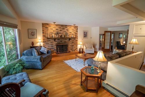242 2Nd Avenue, Fernie, BC - Indoor Photo Showing Living Room With Fireplace