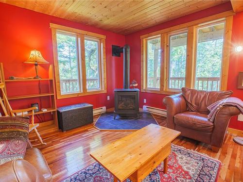 1252 Pacific Rim Hwy, Tofino, BC - Indoor Photo Showing Living Room With Fireplace