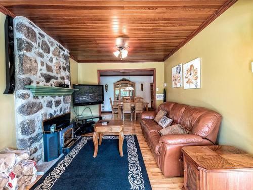 Living room - 1914 Ch. De La Gare, Val-Morin, QC - Indoor Photo Showing Living Room With Fireplace