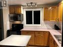1110 Chaplin Street E, Swift Current, SK  - Indoor Photo Showing Kitchen With Double Sink 