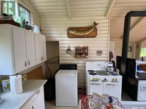Titled Cabin On Rainy Island, Lac La Ronge, SK - Indoor Photo Showing Other Room
