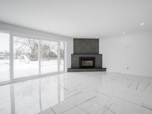 Salon - 22 Boul. Lacombe, Repentigny (Le Gardeur), QC - Indoor Photo Showing Living Room With Fireplace
