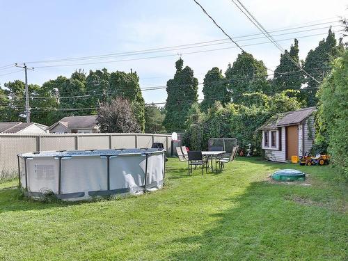 Backyard - 660 Rue Boisvert, Saint-Jean-Sur-Richelieu, QC - Outdoor With Above Ground Pool