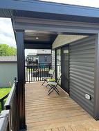 Extended covered deck off primary bedroom. - 