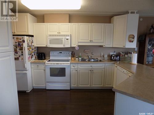 308 445 Government Road, Weyburn, SK - Indoor Photo Showing Kitchen With Double Sink