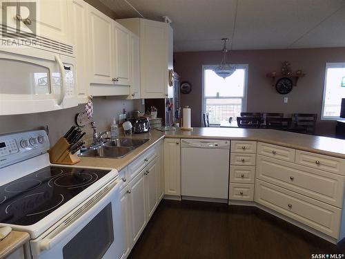 308 445 Government Road, Weyburn, SK - Indoor Photo Showing Kitchen With Double Sink