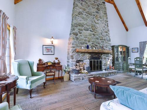 Living room - 15 Rue Leduc, Saint-Clet, QC - Indoor Photo Showing Living Room With Fireplace