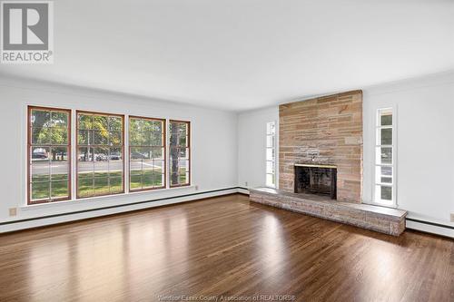 3945-85 Dougall Avenue, Windsor, ON - Indoor Photo Showing Living Room With Fireplace