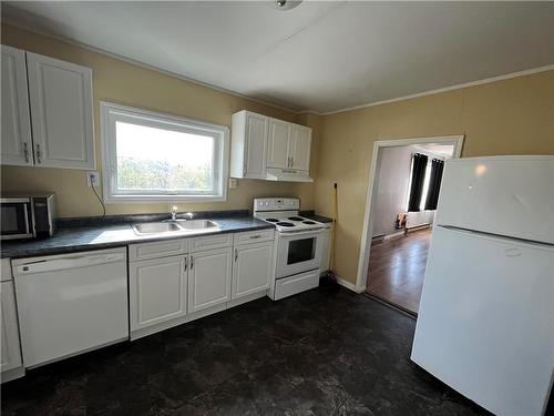 15 Hill Street, Flin Flon, MB - Indoor Photo Showing Kitchen With Double Sink