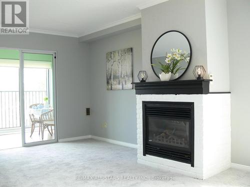 #506 -54 Fittons Rd W, Orillia, ON - Indoor Photo Showing Living Room With Fireplace