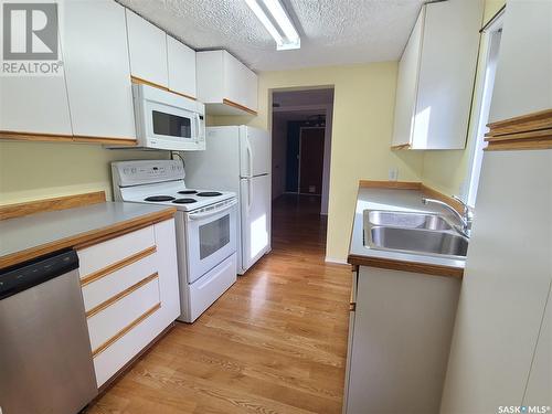 239 10Th Street N, Weyburn, SK - Indoor Photo Showing Kitchen With Double Sink